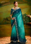 Peacock Blue Heavy Embroidered Fancy Fabric Designer Saree With contrast Blouse.