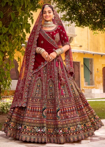 Elegant Traditional Maroon Velvet Bridal Lehenga Choli with Intricate Embroidery.